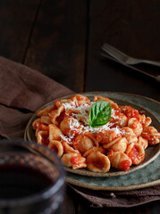 South italian  pasta orecchiette with tomato sauce and cacioricotta cheese
