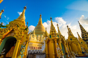 YANGON,MYANMAR-MAY 15.2020: Buddhist Pilgrims in the Shwedagon Pagoda at night. It is the most sacred Buddhist pagoda for the Burmese.