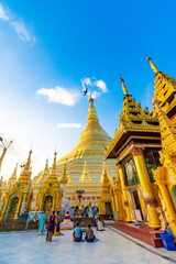 YANGON,MYANMAR-MAY 15.2020: Buddhist Pilgrims in the Shwedagon Pagoda at night. It is the most sacred Buddhist pagoda for the Burmese.