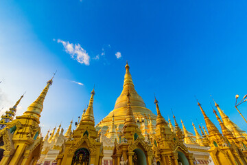 YANGON,MYANMAR-MAY 15.2020: Buddhist Pilgrims in the Shwedagon Pagoda at night. It is the most sacred Buddhist pagoda for the Burmese.