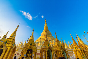 YANGON,MYANMAR-MAY 15.2020: Buddhist Pilgrims in the Shwedagon Pagoda at night. It is the most sacred Buddhist pagoda for the Burmese.