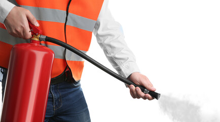 Worker using fire extinguisher on white background, closeup