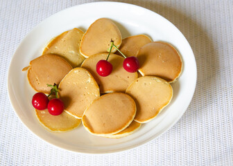 Naklejka na ściany i meble lush pancakes pancakes with berries and jam