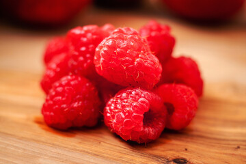 Still life, Red juicy raspberries on a wooden board, Selective focus,