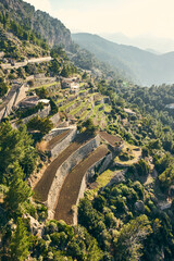 Fototapeta premium Terraced farms on the rocky cliff of northern Mallorca.