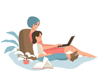 Mom with a child look at the laptop screen.