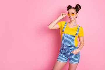 Portrait of her she nice-looking attractive pretty lovely cheerful cheery fashionable content brown-haired teen girlfriend posing touching specs isolated over pink pastel color background