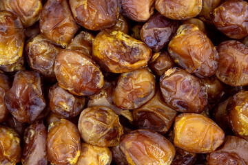 Dried dates background, sort bawalini, vegan sweet superfood, topview