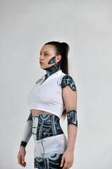 beautiful brunette girl in a robot suit posing in various poses on a white background