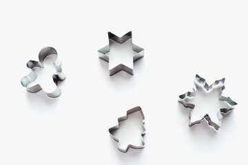 metal cookie cutters, themed cookies, Christmas cookies, bakeware on white background