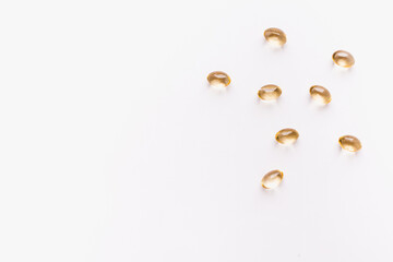 vitamins on white background, vitamins in transparent capsules