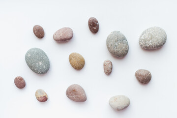 sea stones on white background, smooth stones