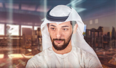 Arabic businessman looking out through glass window in his office