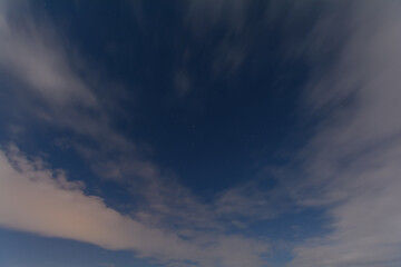 Night sky with clouds and stars.