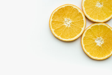 orange on a white background, slices of orange, oranges in circles, cut orange