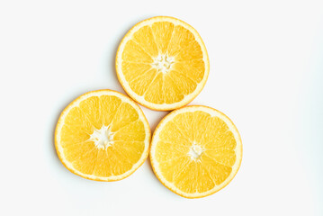 orange on a white background, slices of orange, oranges in circles, cut orange