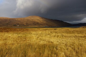 Obraz premium A storm approaching Loch Ainort on the Island of Skye, Inner Hebrides, Scotland, UK.