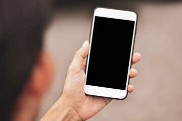 Hand holding phone focus on screen empty mock up design