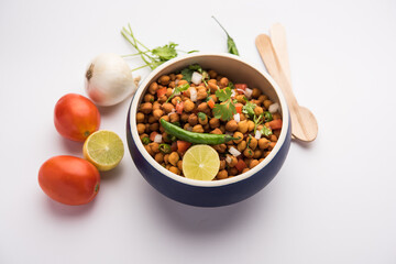Black Chickpea Chaat or Kala Chana Chat recipe is a popular snack recipe from India, served in a...