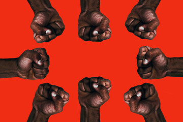 United african black fists raised calling for freedom and equality on a red background.
