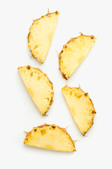 Naklejka premium pineapple slices on white background