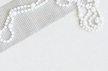 white beads on the grey surface of the table