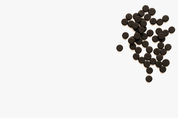 pills on white background, activated carbon on white background