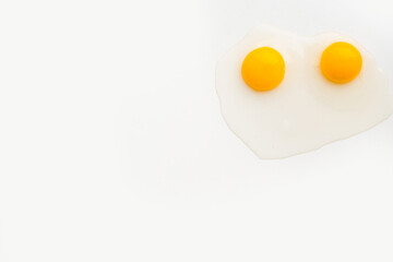 chicken yolk on a white plate, chicken eggs on a white plate, chicken yolk