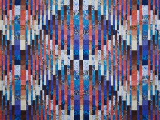 Quilt made in the style of bargello using the convergence effect