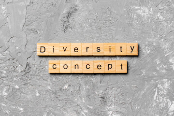 Diversity concept word written on wood block. Diversity concept text on cement table for your desing