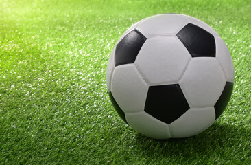 Fototapeta na wymiar Soccer ball on green grass.