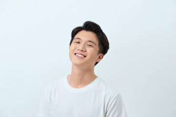 Portrait of a young Asian man making a confident smile