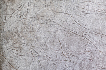 Textural background in gray tones. Wallpaper with an abstract pattern.