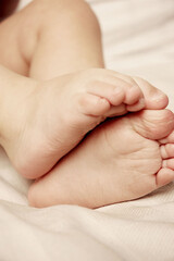 Baby feet detail at bedroom