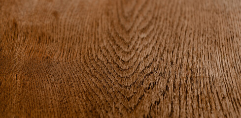 Wooden texture. Treated brown color wood, abstract pattern or background. Close up shot. Macro image.