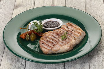 Grilled pork steak with pepper sauce