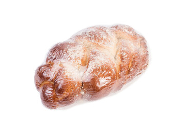 bun, bread in the package on a white background. sprinkled flour