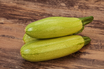 Young tasty zucchini over board