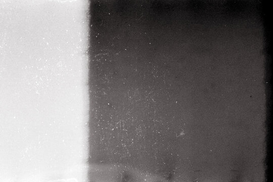 Noisy film frame with heavy scratches, dust and grain