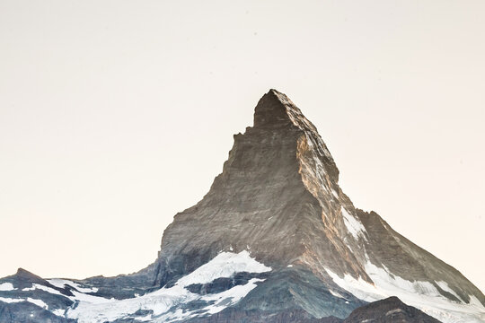 Zermatt, Switzerland. Matterhorn mountain near Grindjisee Lake with flowers in the foreground. Canton of Valais.