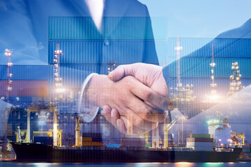 Businessman standing cargo at the container yard and greeting each other with handshake for success deal partnership on construction site Cargo freight ship for import and export. Teamwork concept