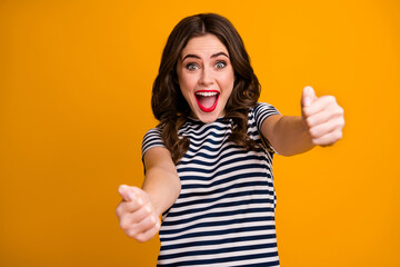 Photo of crazy pretty lady hold imagine steering wheel helm rudder passing driving exam good mood fast speed wear casual striped t-shirt isolated vivid yellow color background