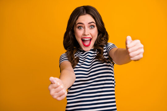 Photo of crazy pretty lady hold imagine steering wheel helm rudder passing driving exam good mood fast speed wear casual striped t-shirt isolated vivid yellow color background