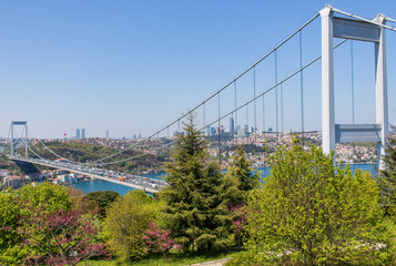 Fototapeta na wymiar Istanbul, Turkey - completed in 1988 and one of the main landmarks in Istanbul, the Fatih Sultan Mehmet Bridge connects Europe and Asia. Here in particular the bridge seen from Fatih Korusu park