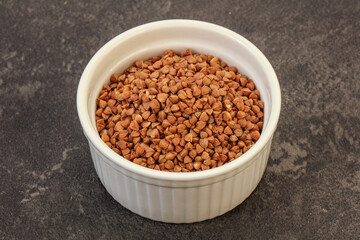 Raw buсkwheat cereal in the bowl