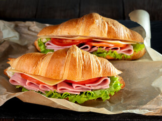 ham and cheese croissant sandwich on a table