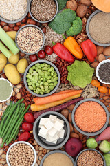 Vegan food for good health and ethical eating with foods high in protein, vitamins, minerals, anthocyanins, antioxidants, smart carbs and dietary fibre. Flat lay.