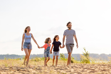 Young family enjoying time at the beach 
