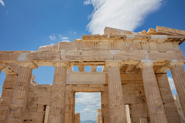 Fototapeta premium Athens, Greece. Propylaea in the Acropolis, monumental gate roof, blue cloudy sky