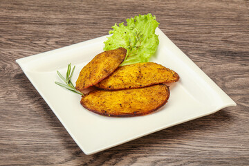 Baked potato with herbs and spices